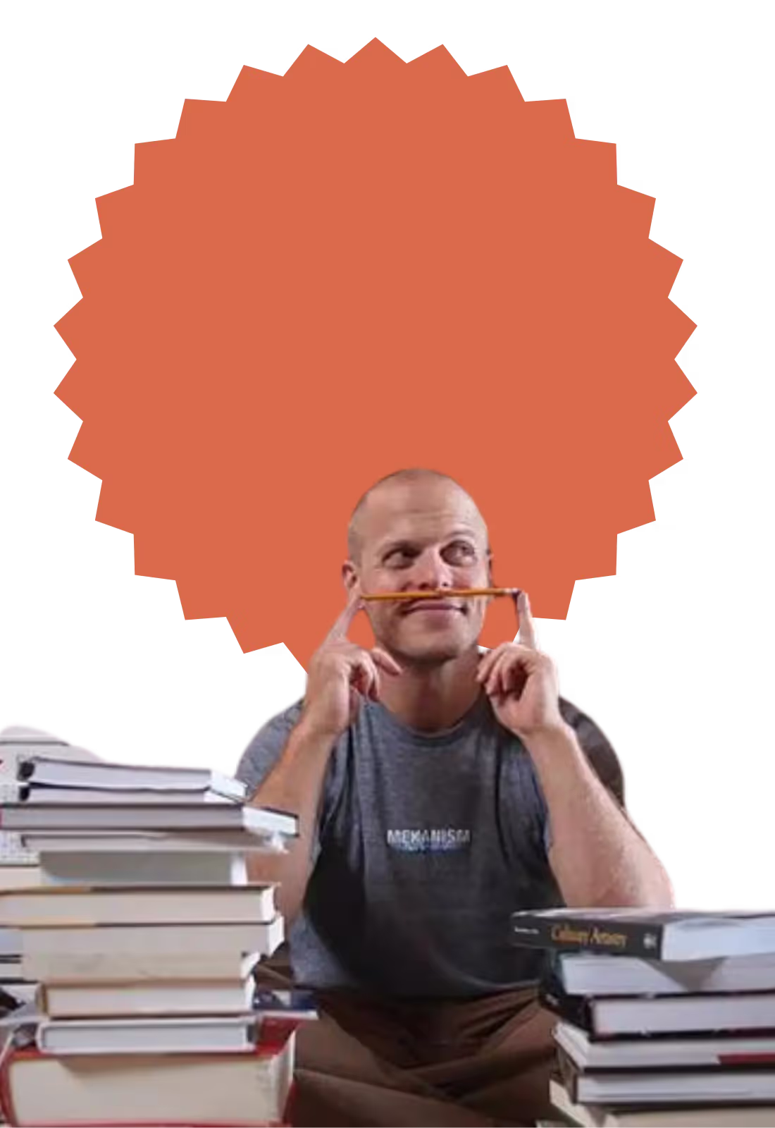 A man with a pencil in his ear and a stack of books behind him.